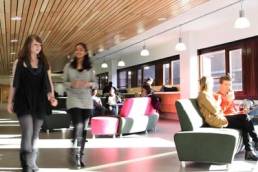 women walking through lobby