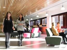 women walking through lobby