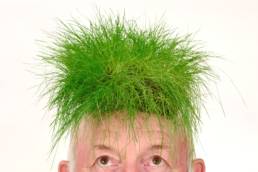 Grass on an old mans head