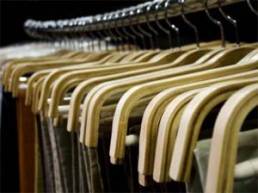 Skirts and trousers on clothes rail in a retail store