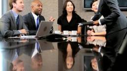 female-business-executive-in-a-boardroom-meeting-with-her-multi-ethnic-business-team