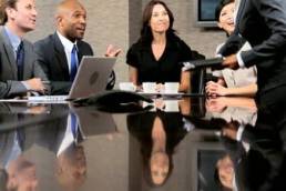 female-business-executive-in-a-boardroom-meeting-with-her-multi-ethnic-business-team