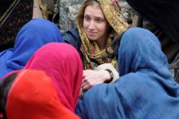 woman volunteering with women abroad featured