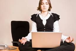 Woman meditating on her desk