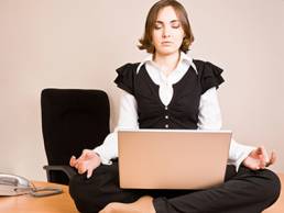 Woman meditating on her desk