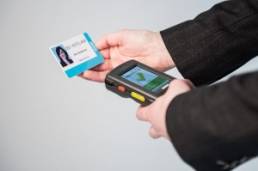 Person using a badging machine