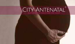 Pregnant woman holding her stomach