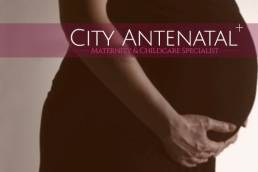 Pregnant woman holding her stomach