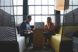 Man and woman discussing business