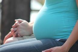 Expecting parents holding hands