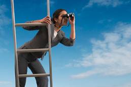 Woman on a ladder searching