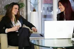 meeting-between-two-business-woman-at-a-desk-shallow-depth-of-field-thumb