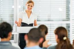 woman talking to crowd featured