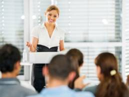 woman talking to crowd featured