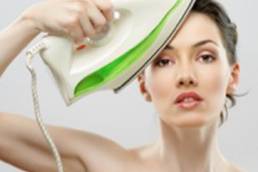 women ironng face featured