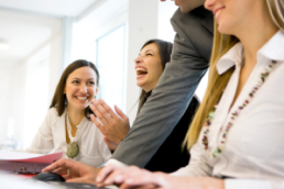 Laughing businesswoman at meeting