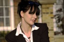 lady sitting outside house