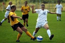 women playing football