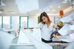 busy woman at photocopier featured