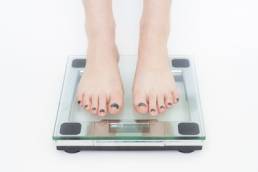 woman on scales featured