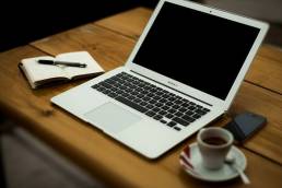 Laptop and coffee cup