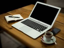 Laptop and coffee cup