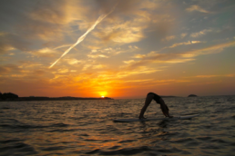 38 North woman on a surfing board in the sea featured