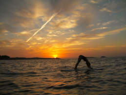 38 North woman on a surfing board in the sea featured