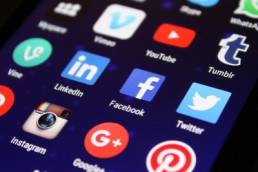 A phone with popular social media apps, such as Twitter, Facebook, Pinterest and Instagram