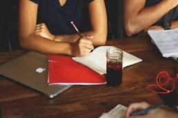 woman discussing things at a meeting featured