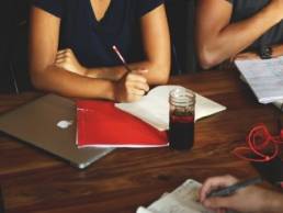 woman discussing things at a meeting featured