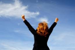 Businesswoman shouting her victory to the world