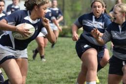 women playing rugby, women's sport week featured