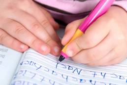 child learning to write featured