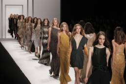 fashion models walking down the catwalk featured