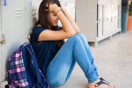 teenage-girl-crying-at-school-featured