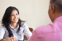 woman-being-supported-by-male-colleague-featured