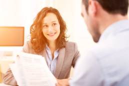 young graduate woman being interviewed for a job featured
