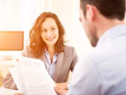 young graduate woman being interviewed for a job featured