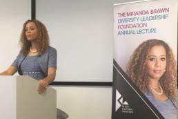 Miranda Brawn Diversity Lecture on a podium talking