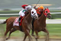 female-jockeys-riding-in-a-race-featured