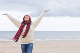 happy-woman-during-winter-winter-blues-featured