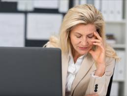 Blonde woman upset by her laptop, unhappy about the gender gap