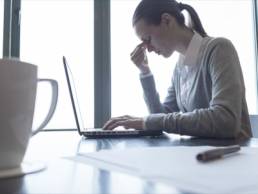 gender pay-gap woman stressed in desk