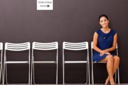 smartly-dressed-woman-waiting-for-interview-featured