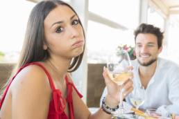 woman-looking-sad-on-a-date-featured
