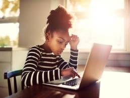young-girl-working-on-a-computer-stem-featured