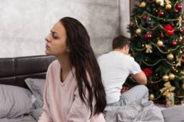 sad looking couple on christmas featured