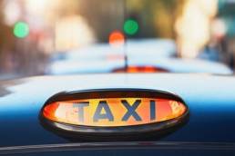 taxi sign, female taxi drivers featured
