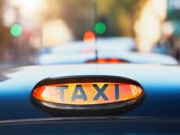 taxi sign, female taxi drivers featured